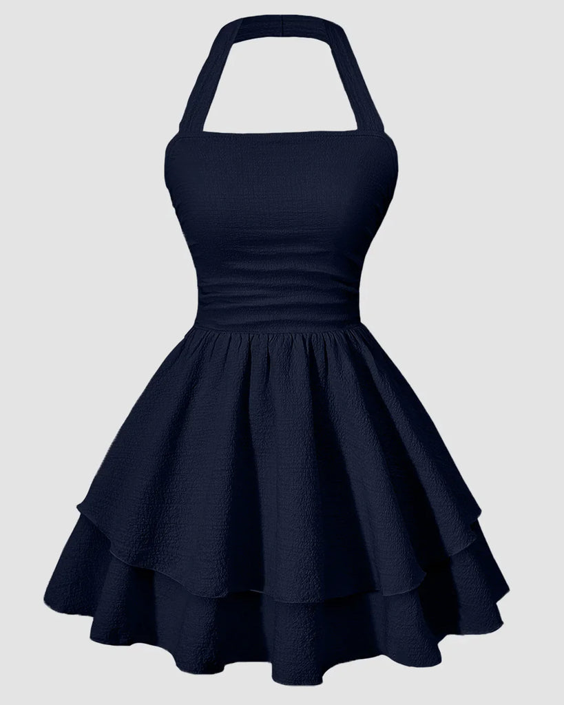 9f60154788dca4a9dd433906bc2c94fc_1024x1024.jpg Halter Neck Ruched Waist Tiered Mini Dress in Navy Blue - Image 1